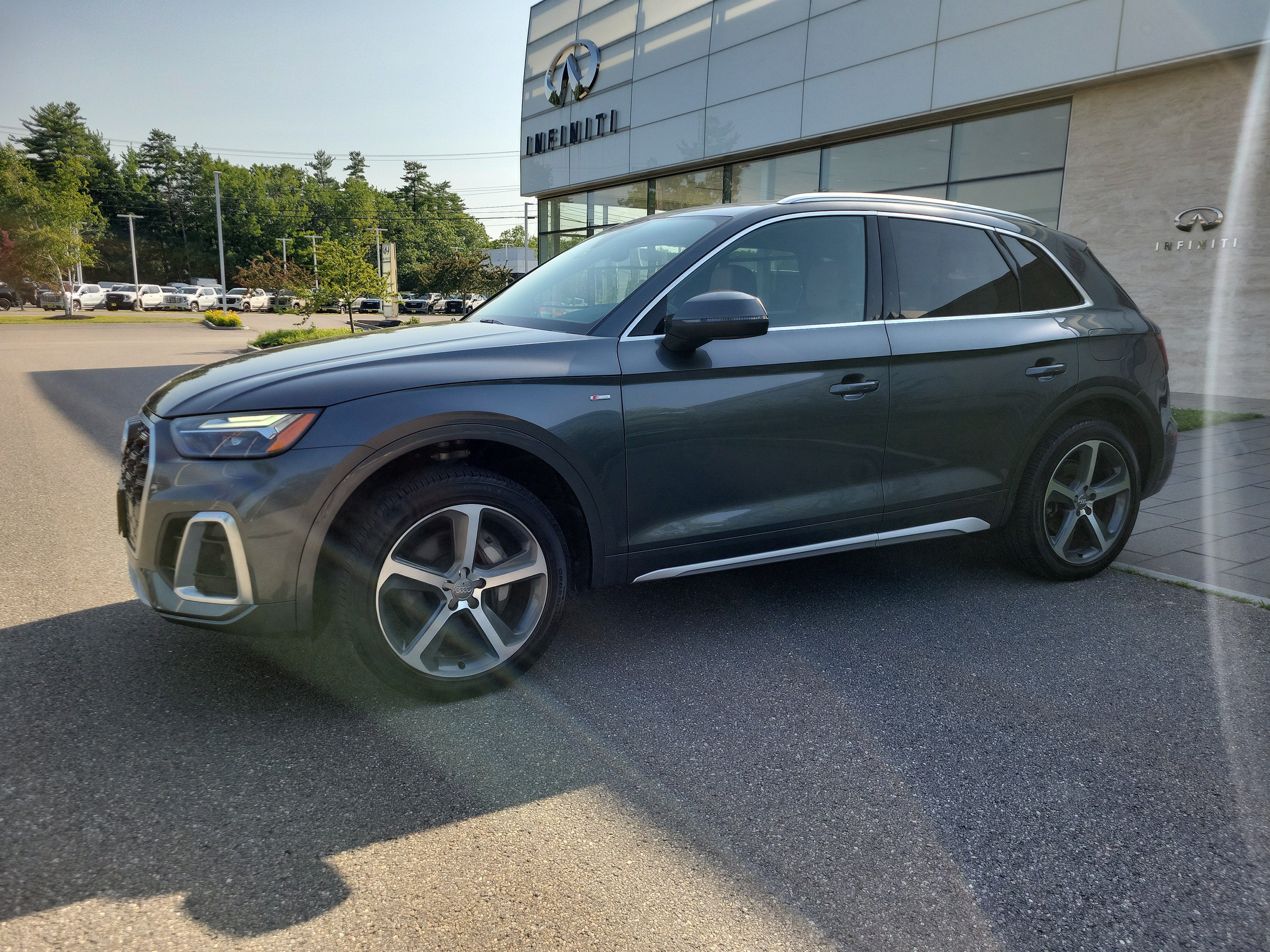 2021 Audi Q5 Premium Plus in Daytona Gray Pearl — front three-quarter view